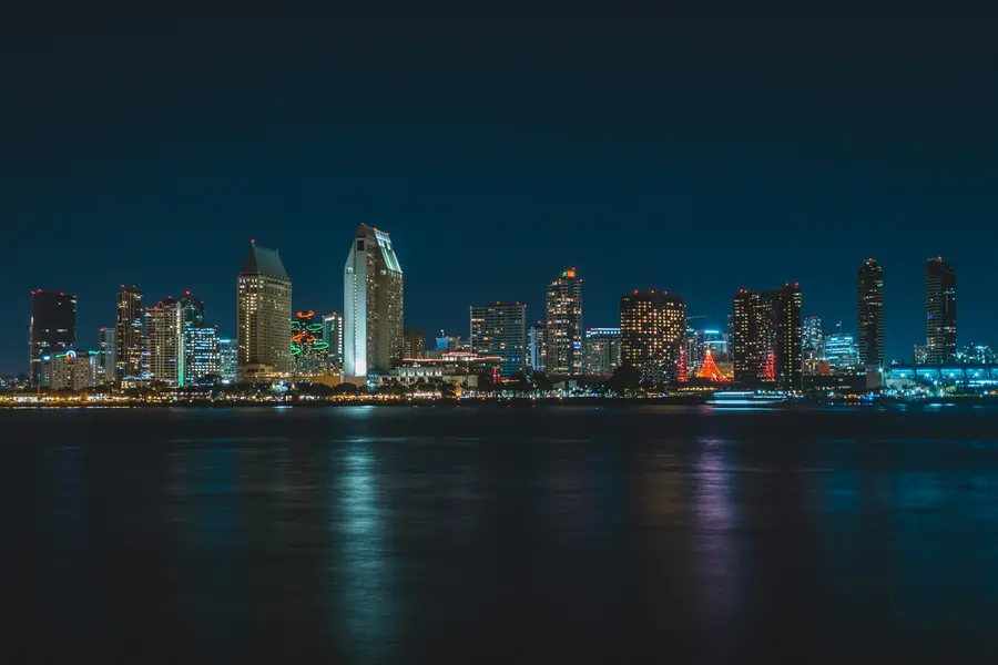 Downtown San Diego skyline reflected on the bay at night