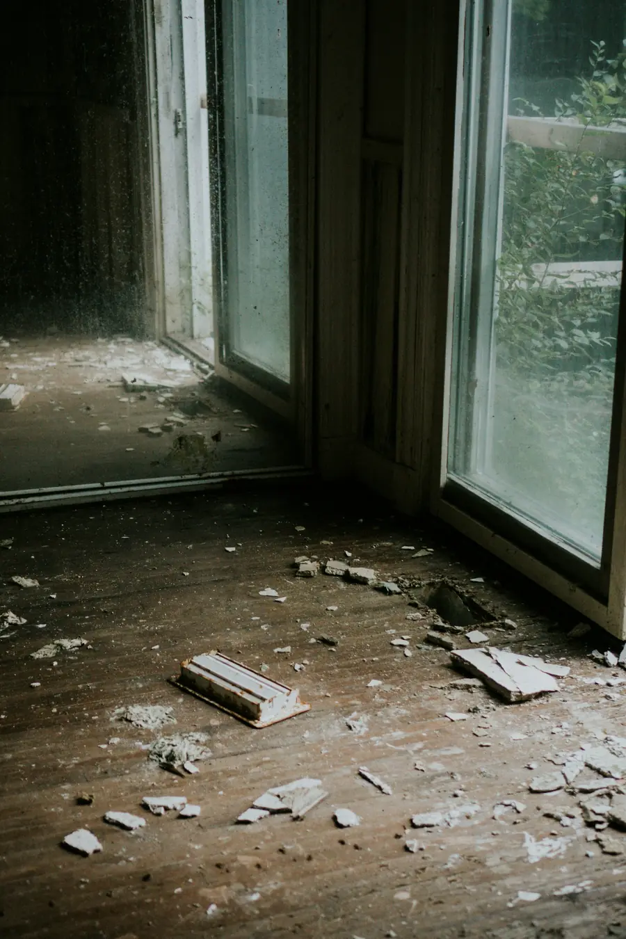 Room with debris and soot stained walls after a fire